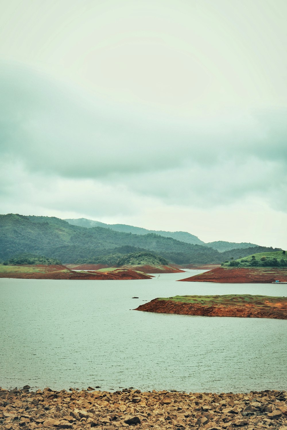 a body of water with land in the back