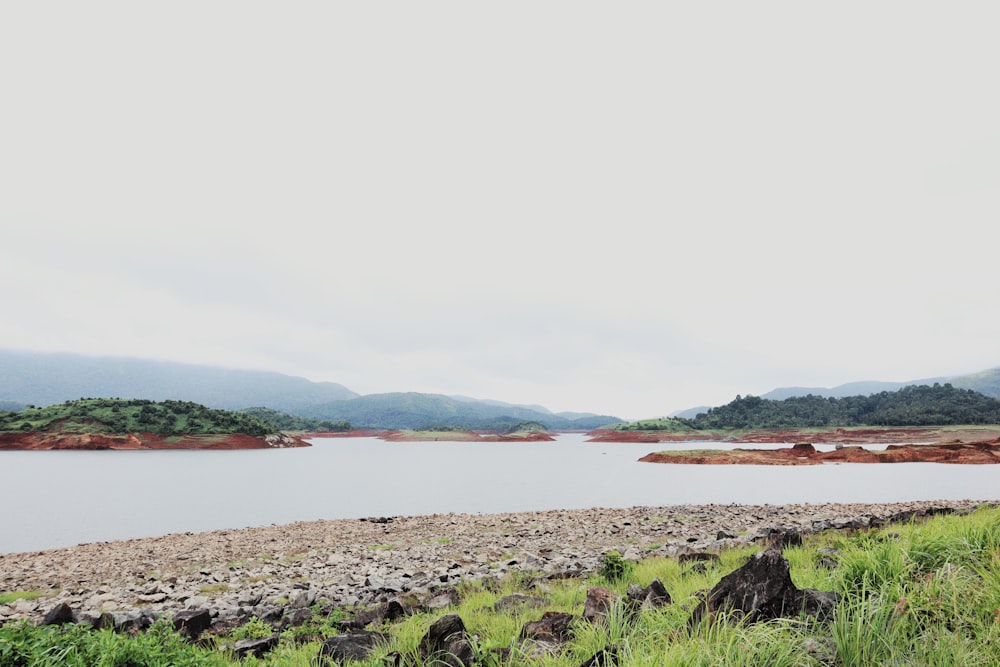 a body of water with land in the back