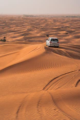 a car driving through a desert
