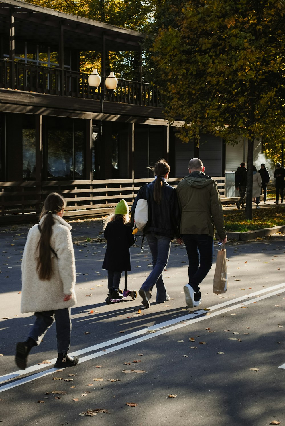 a group of people walking down a street