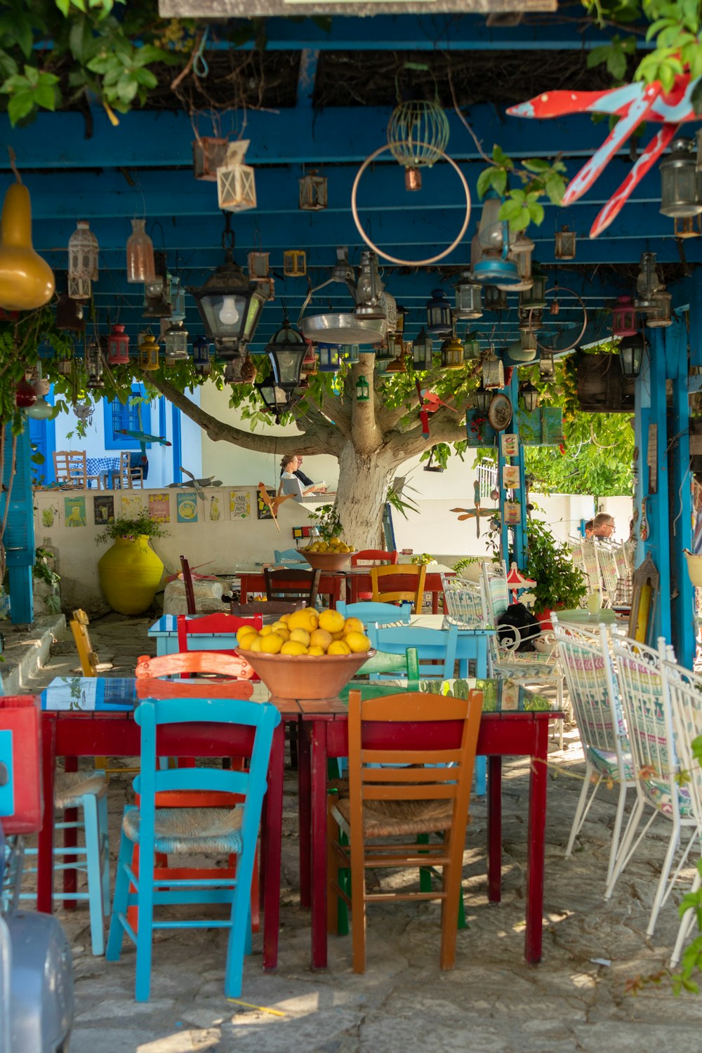 a table with chairs and tables with food on it