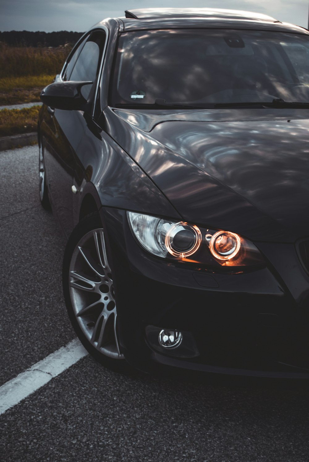 a black car parked in a parking lot