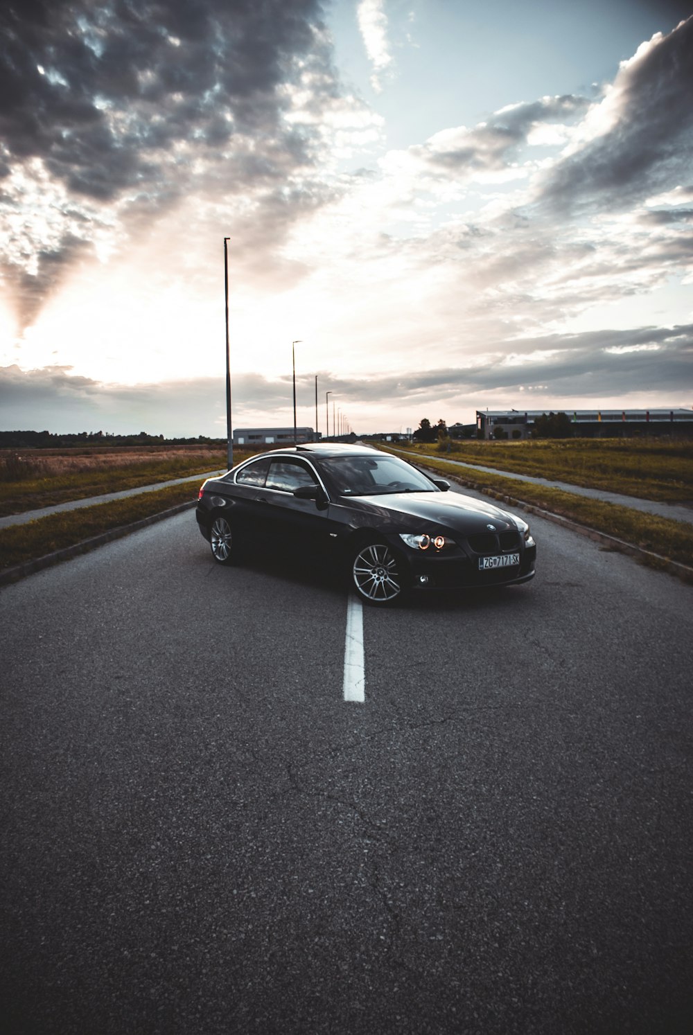 a black sports car on a road