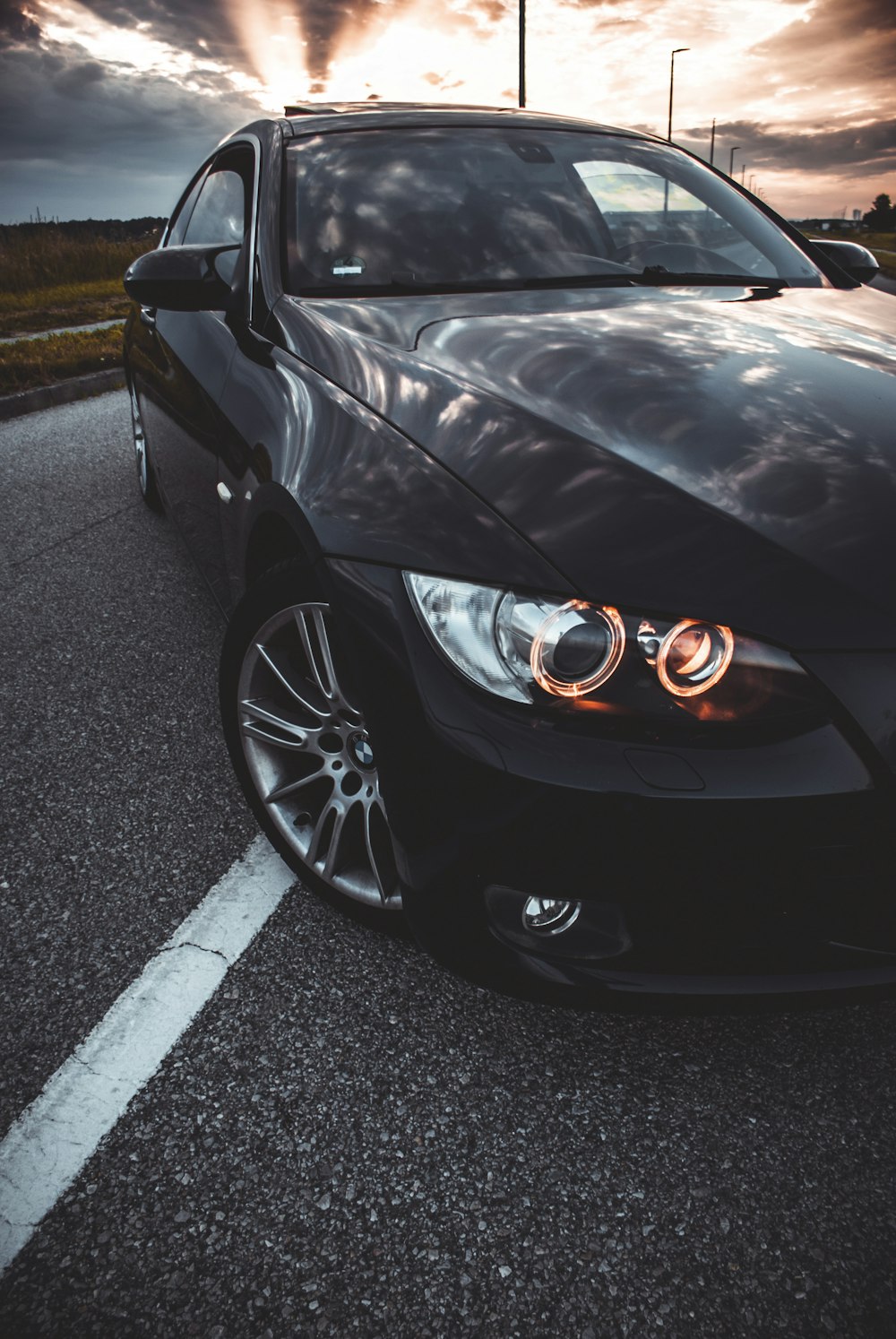 a black car parked in a parking lot