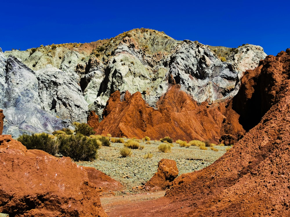 a rocky mountain with a valley below