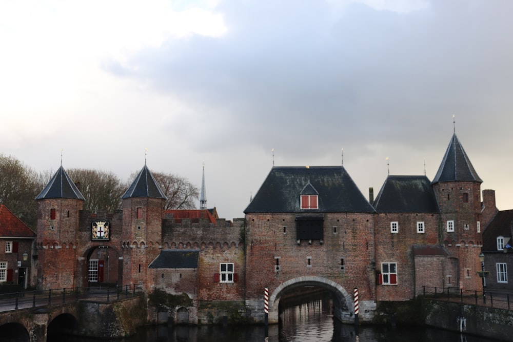 a large brick building with a bridge