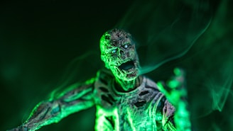 A cluster of zombies shuffling forward with eerie green glows in their eyes.