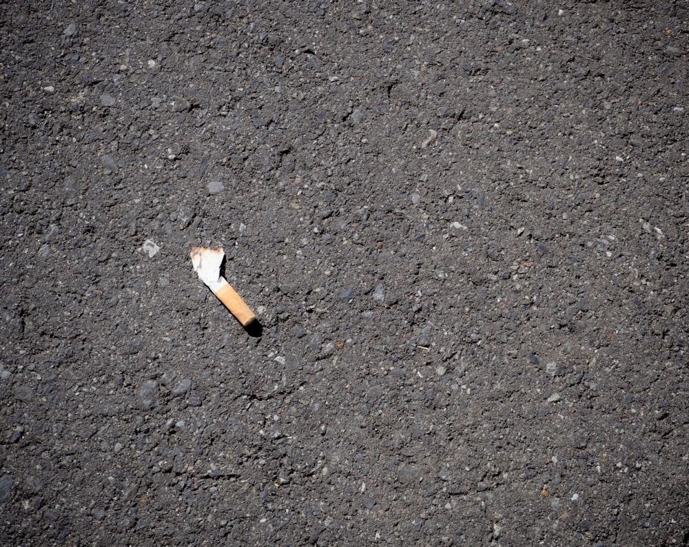a cigarette on the ground