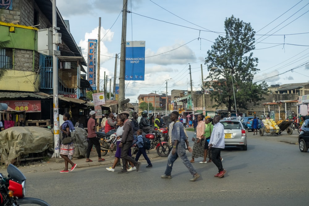 a group of people walking down a street