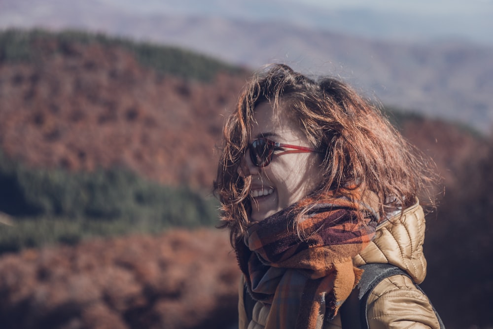 a person with long hair and sunglasses