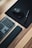 A close-up of a stylish ergonomic keyboard and mouse on a clean desk.