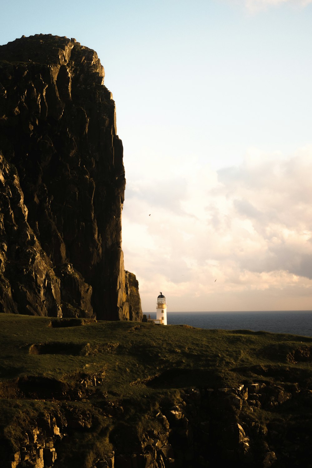 a lighthouse on a cliff