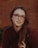 a person with long hair and glasses