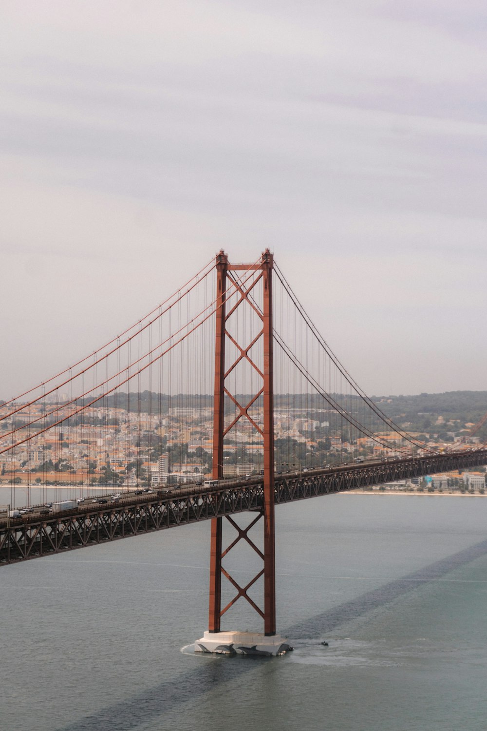 a large red bridge over water