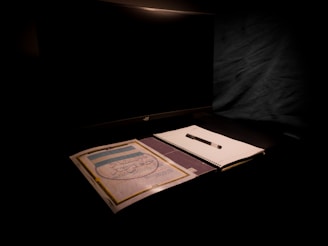A professional office setting with a computer and notepad.