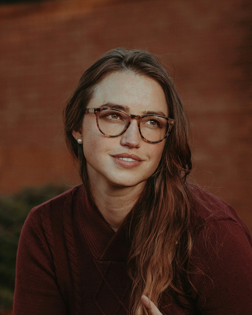 a person in glasses looking at the camera