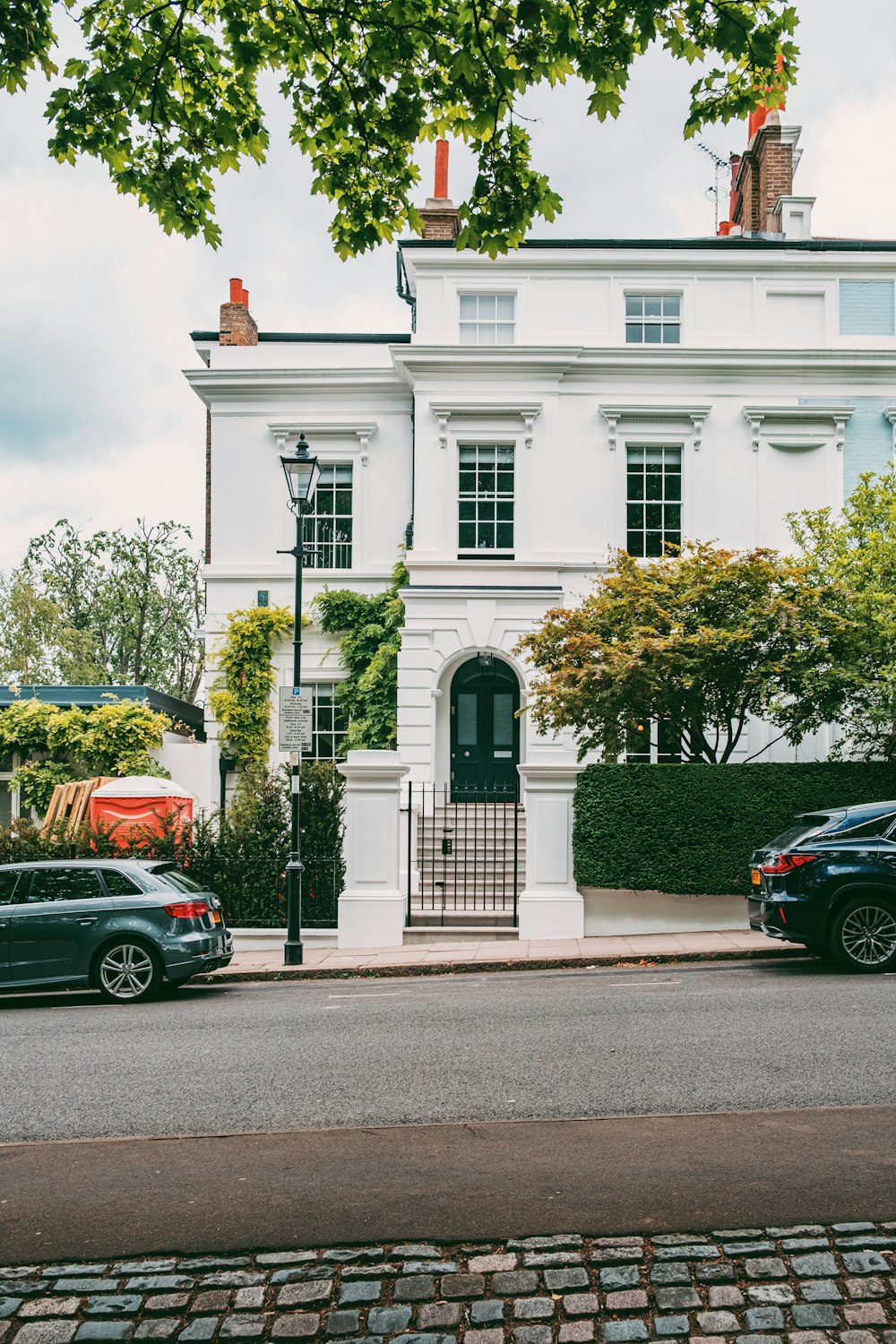 a white building with a gate