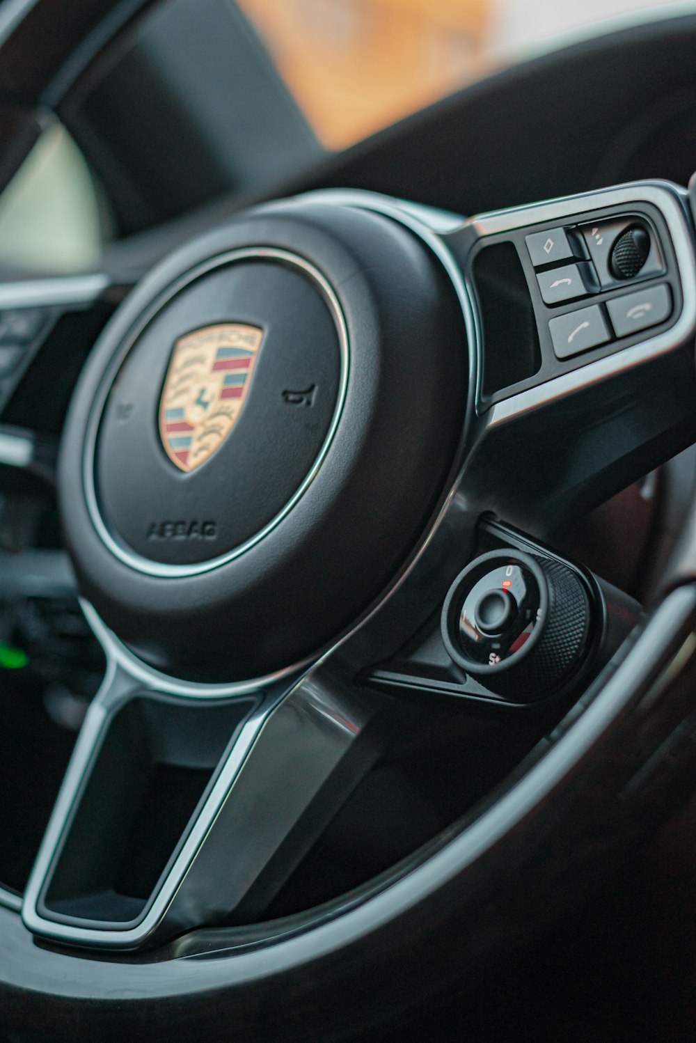 a steering wheel and dashboard of a car