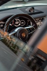 a car steering wheel and dashboard