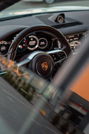 a car steering wheel and dashboard