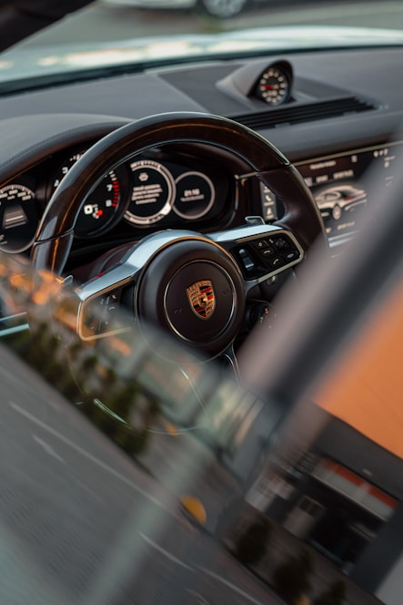 a car steering wheel and dashboard