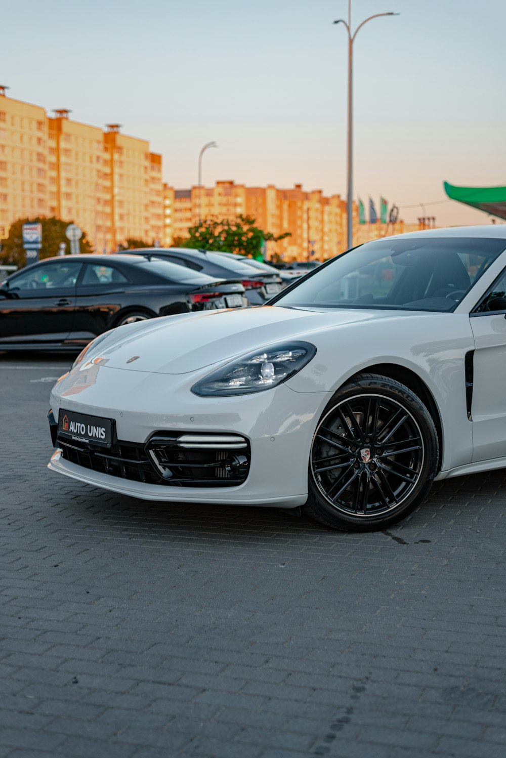 a white car parked in a parking lot