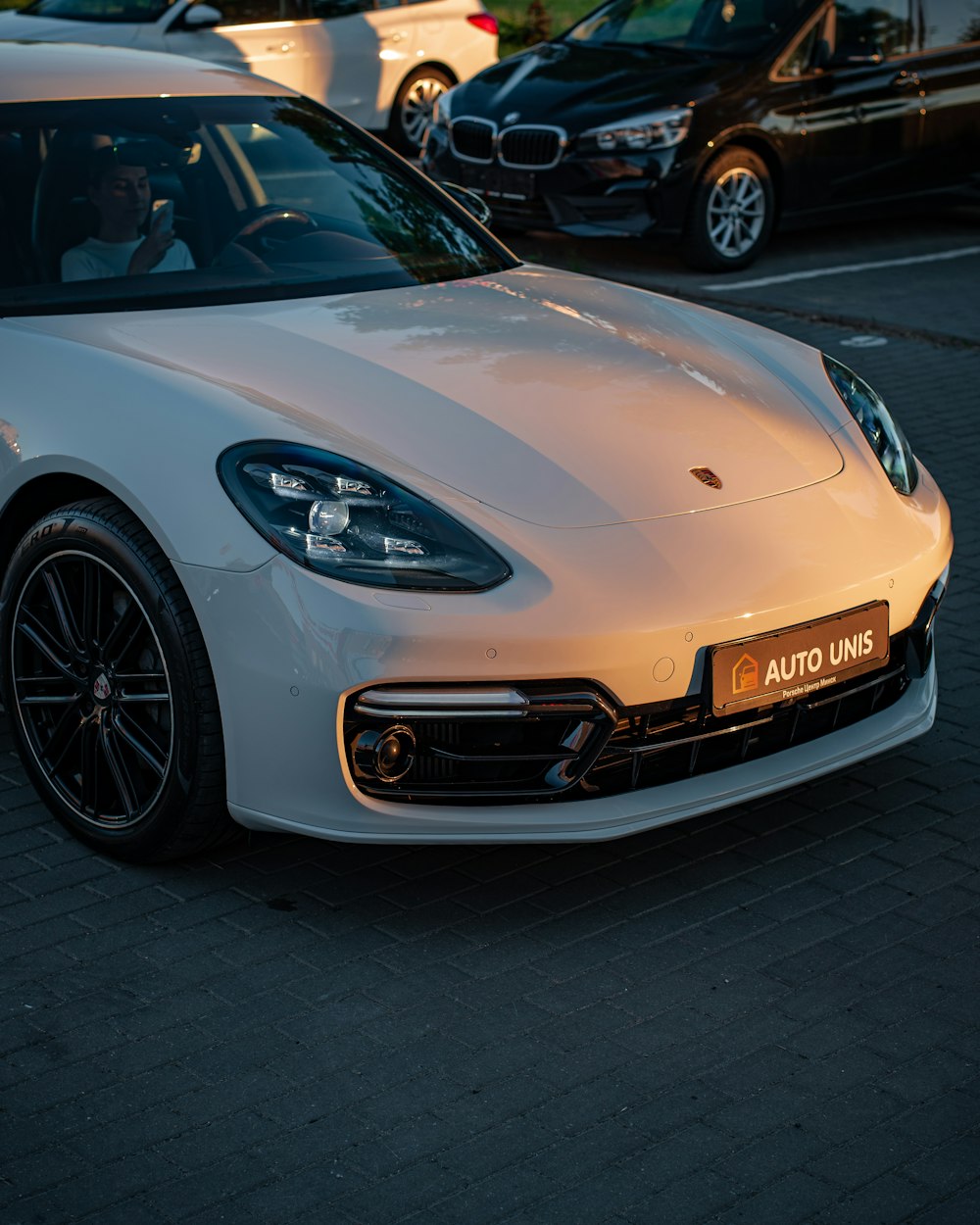 a white car parked in a parking lot