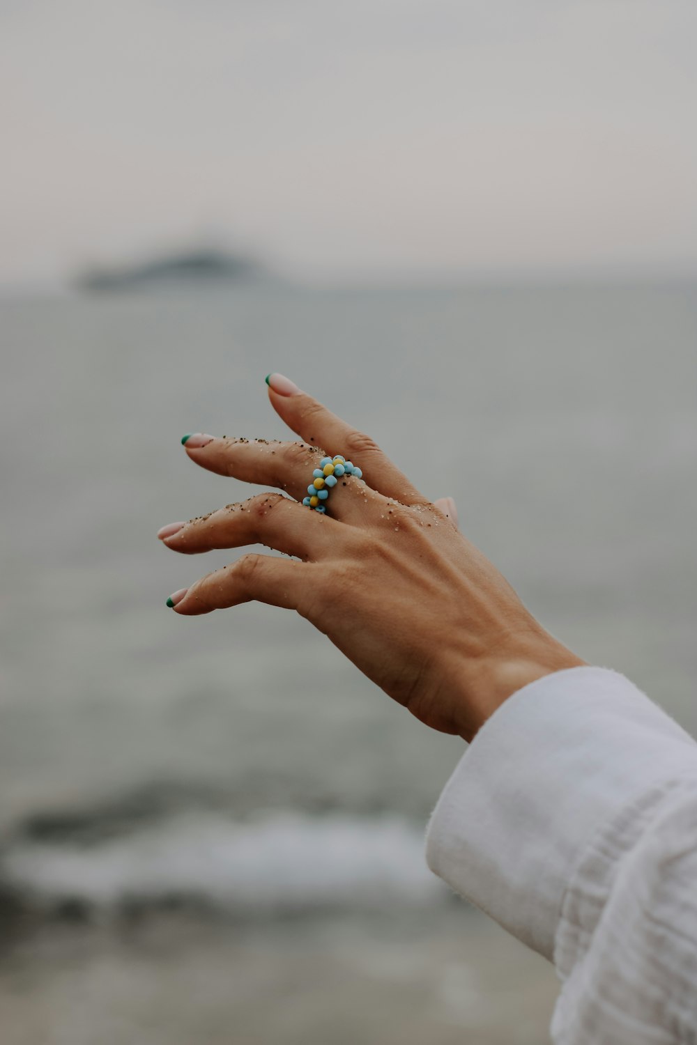 a hand with a ring on it