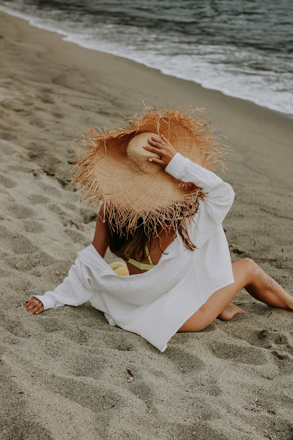 a person lying on the beach