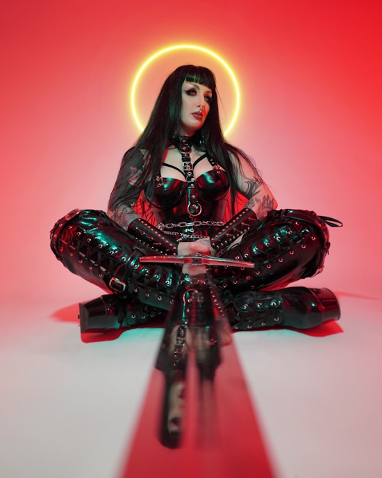 a dominant woman in black leather BDSM  fetish gearfetish