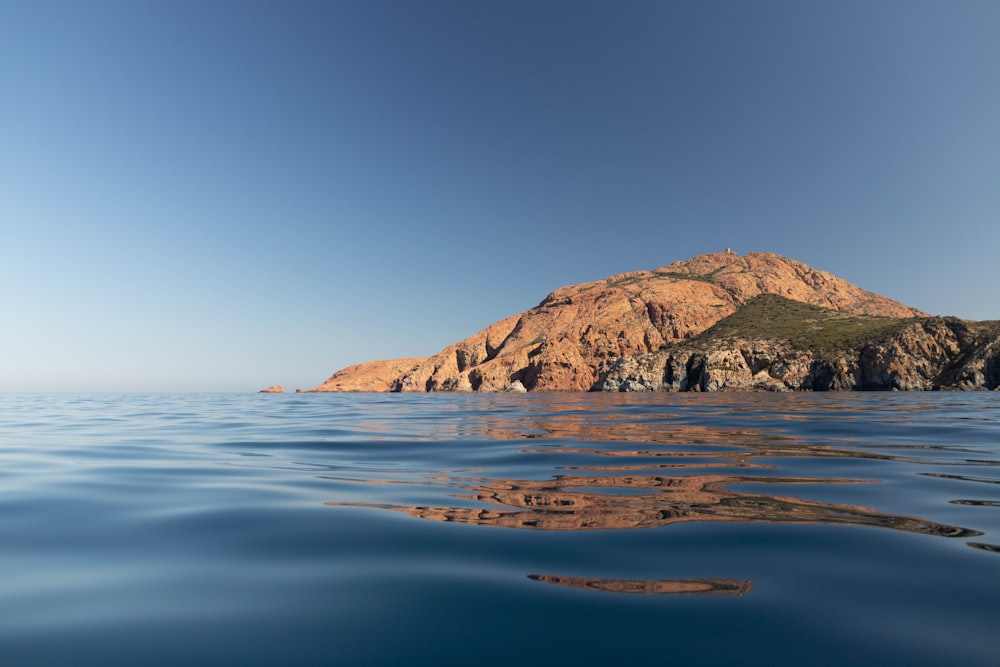 a rocky island in the water