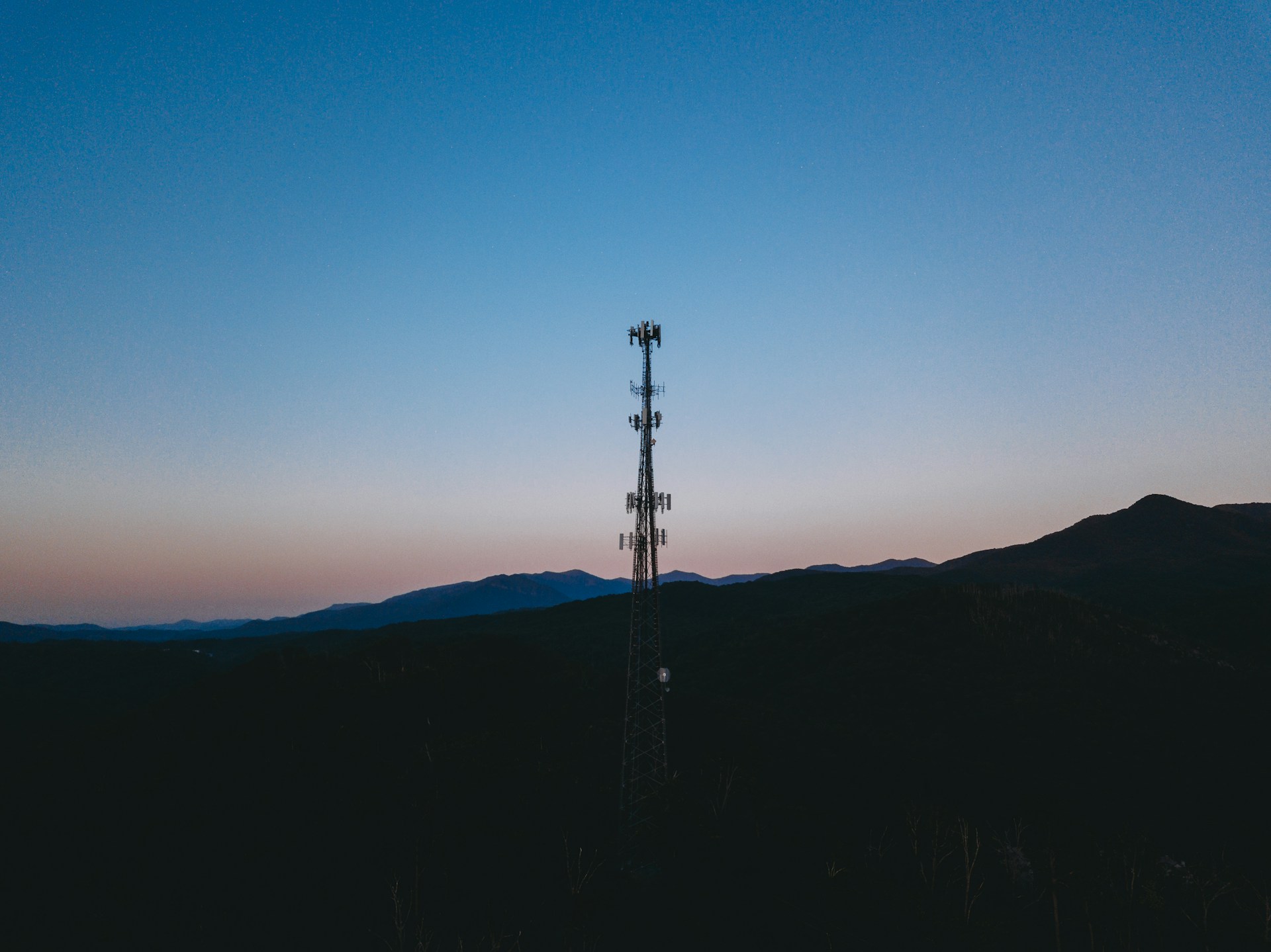 a person with a sunset in the background