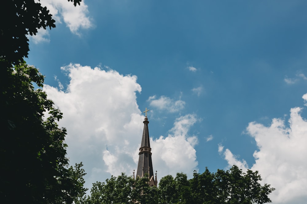 a tall building with a cross on top