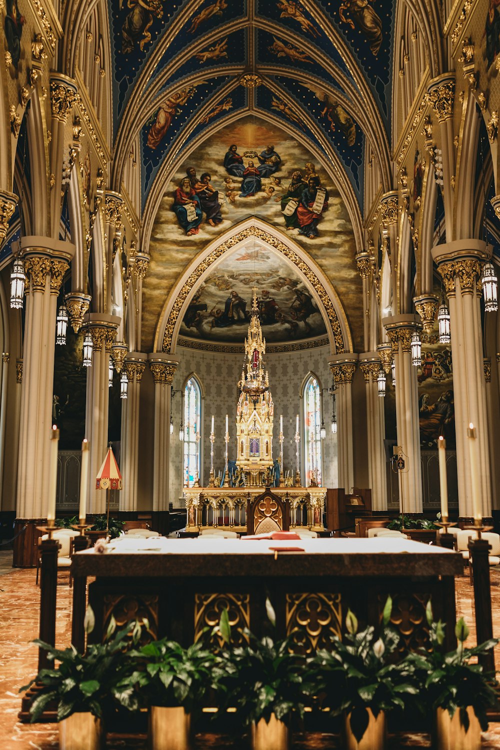 a large ornate church with a large stained glass window