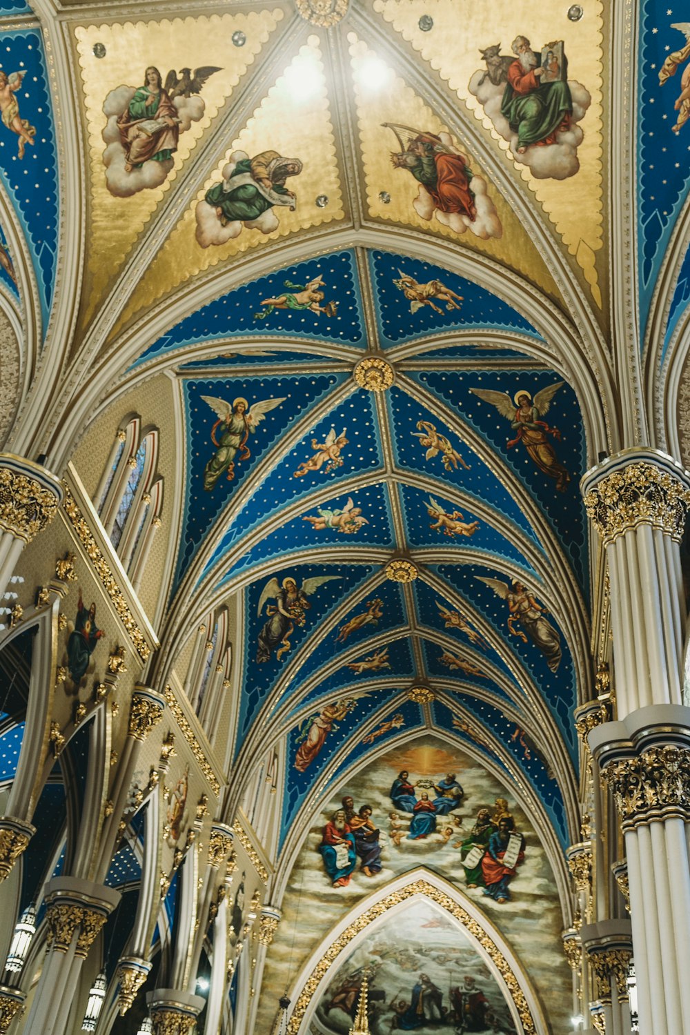 a ceiling with paintings and statues