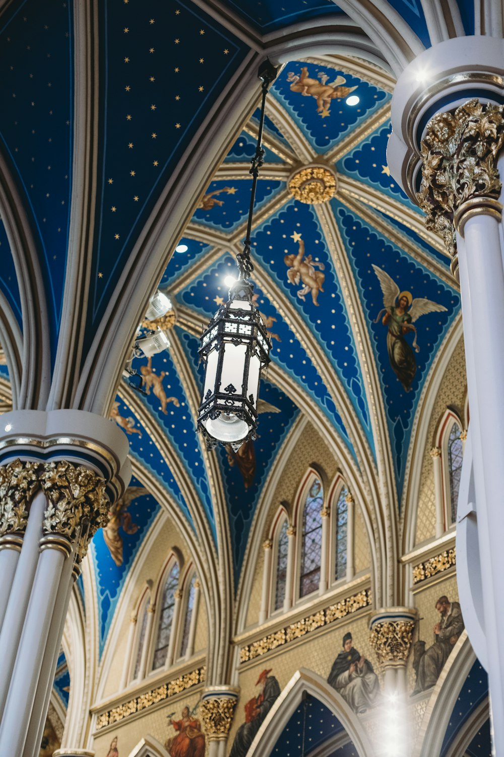 a large ornate ceiling with statues