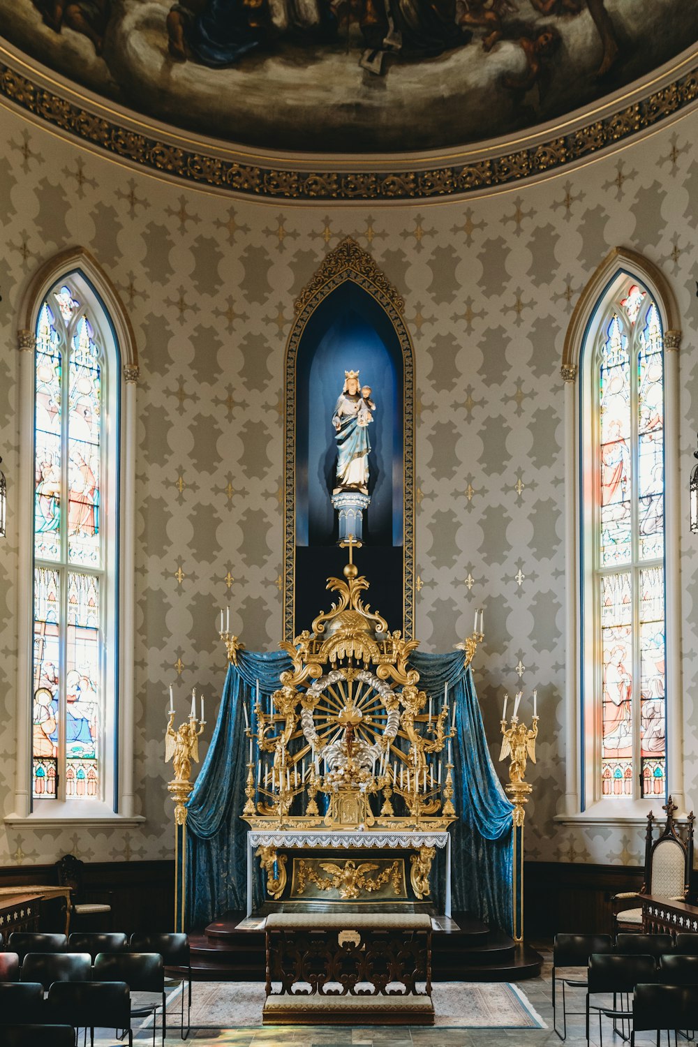 a gold and blue religious statue