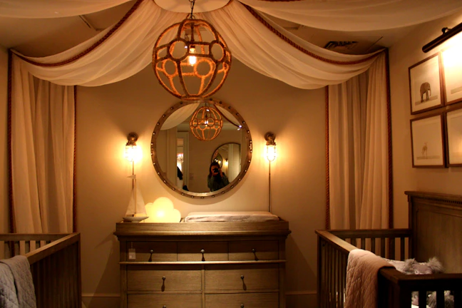 Stylish baby room with boutique decor and warm lighting.