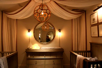 A cozy nursery corner with soft pastel colors, featuring a baby crib and plush toys.