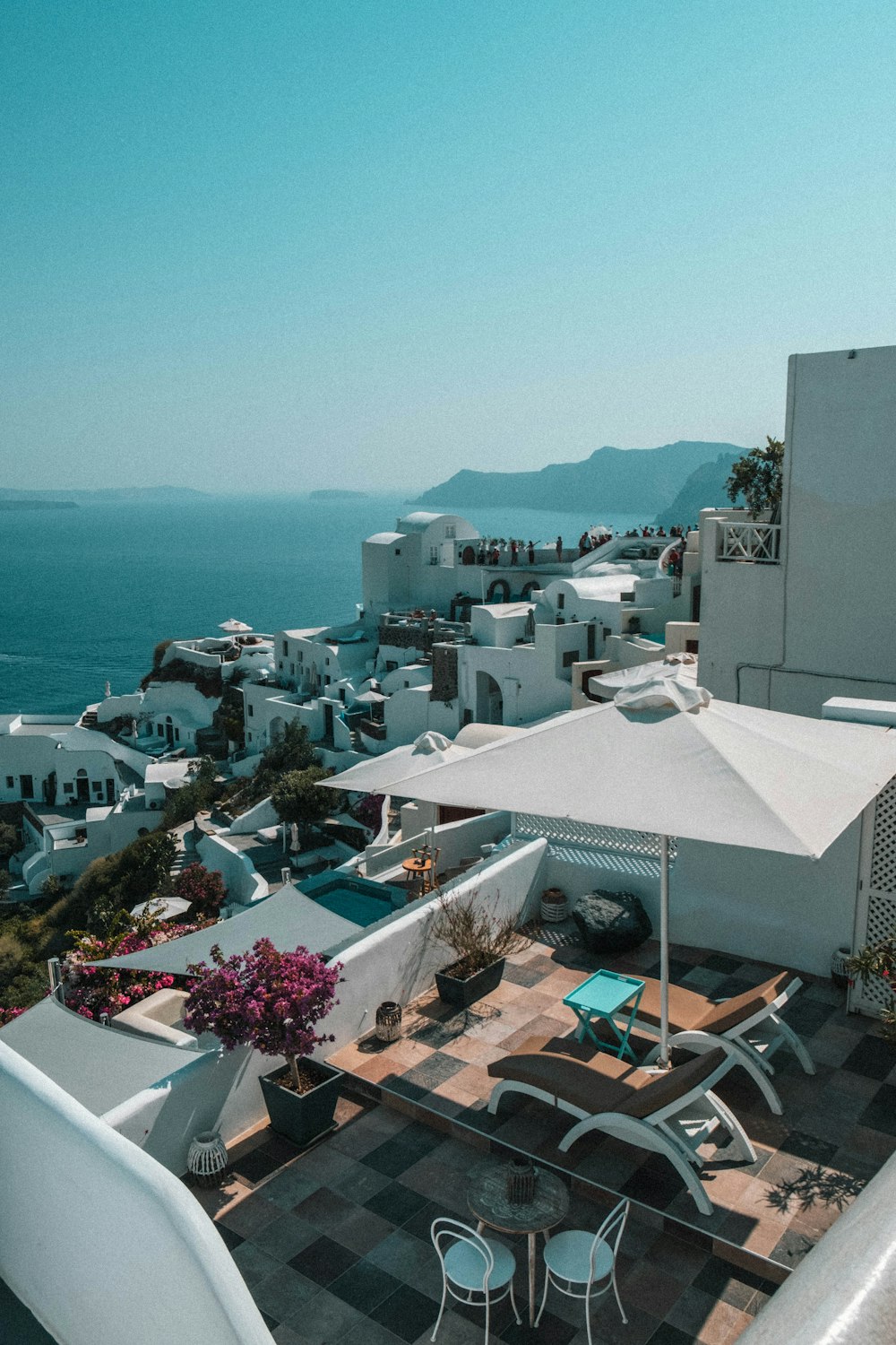 a view of a town and the ocean from a balcony