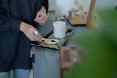 a person holding a cup