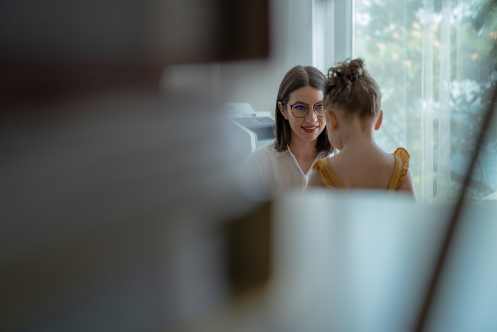 a woman looking at a man