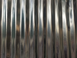 A close-up of roofing sheets being formed.