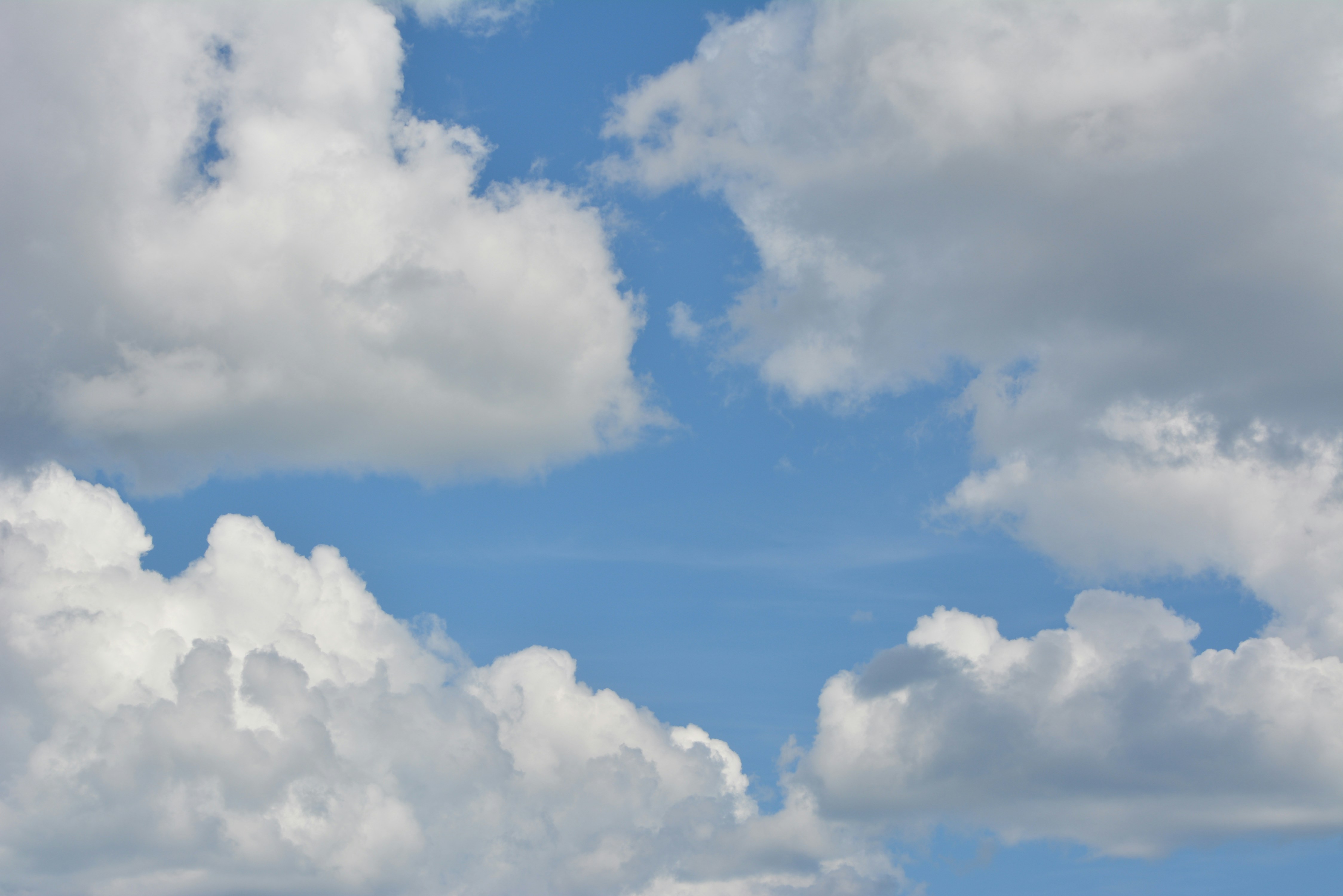 a blue sky with white clouds