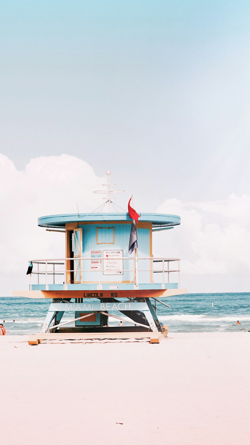 a small building on a beach