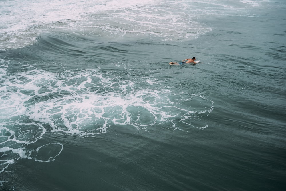 a person swimming in the ocean