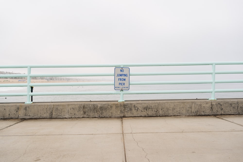 a sign on a railing