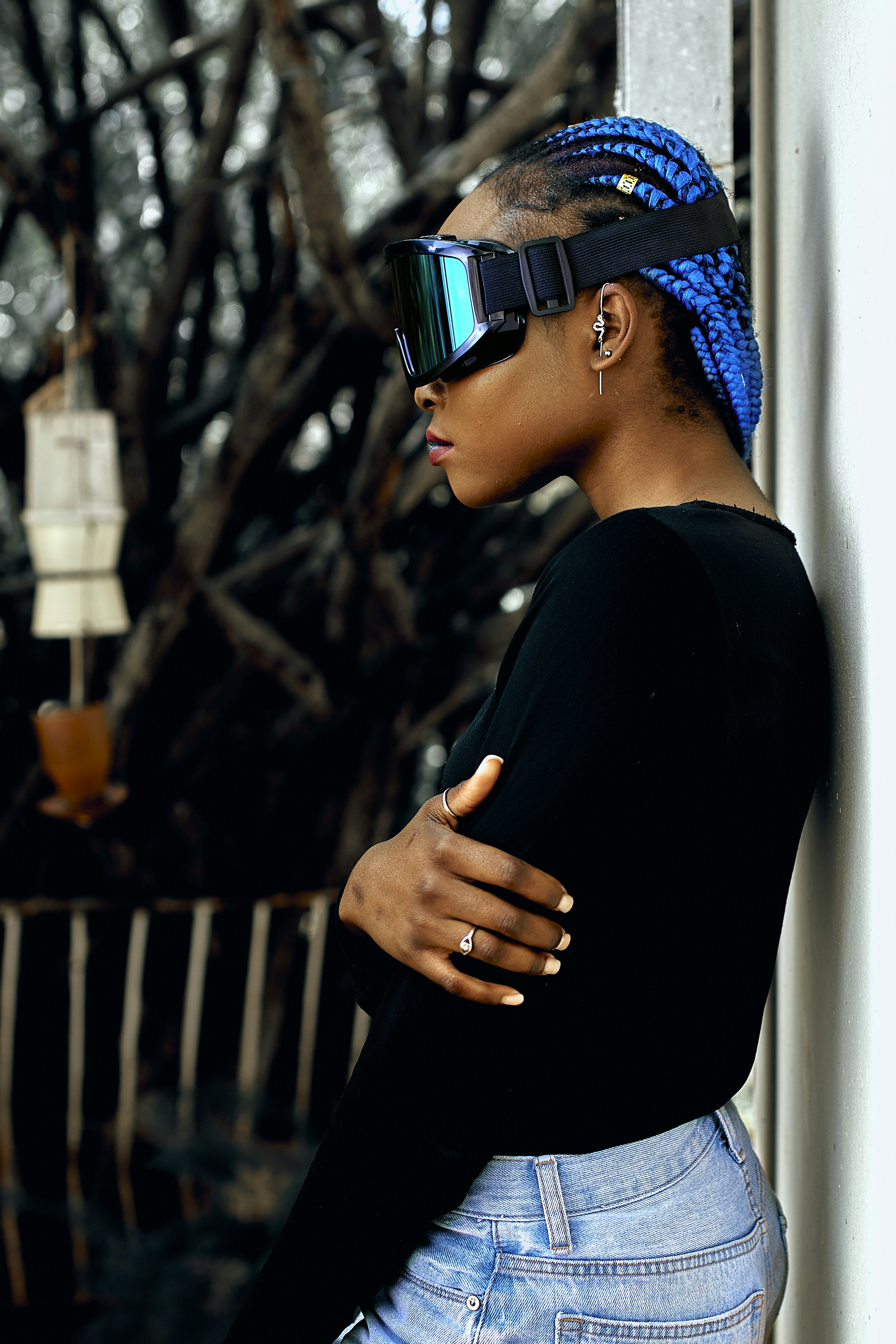 a person wearing a hat and sunglasses