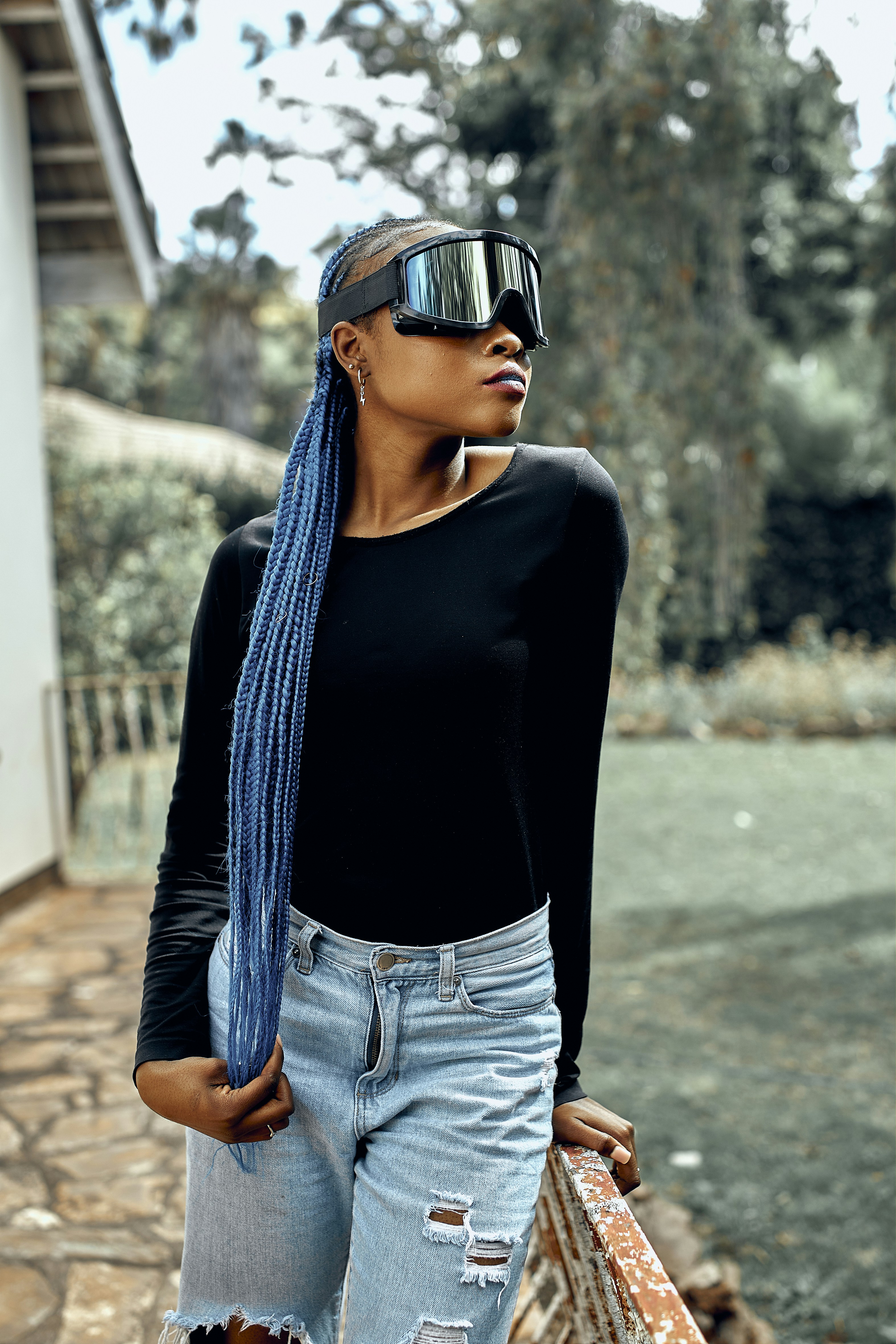 a person wearing sunglasses and a hat