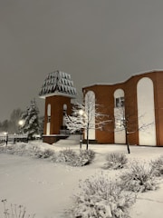 A modern data center in Finland surrounded by snowy landscape.